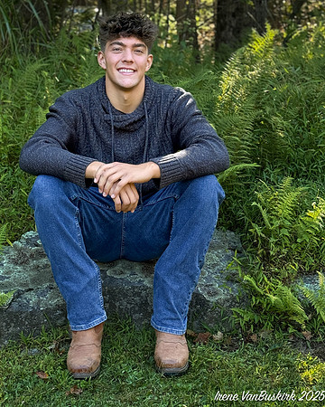 Nick w sweater on rock